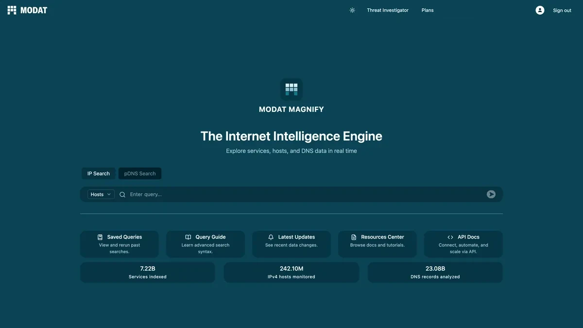 Modat Magnify on a laptop, showing the screen you land on at magnify.modat.io: the Internet Intelligence Engine, with IP Search and pDNS Search tabs, a query box, and shortcuts to saved queries, the query guide, updates, the resource centre and the API docs.